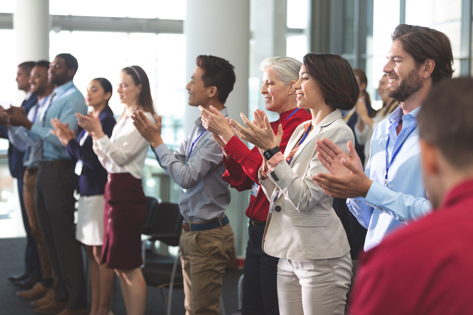 trade show attendees clapping